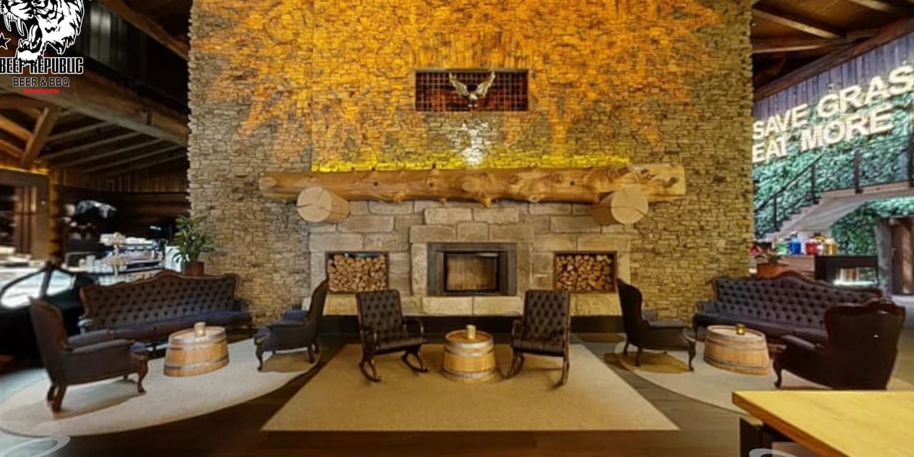Timberjacks – lounge with natural stone wall and seating around the fireplace